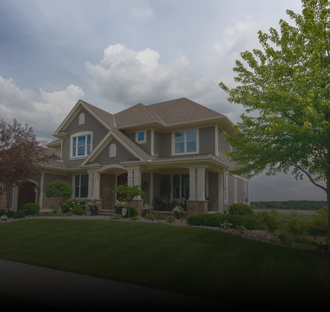 Suburban house with cloudy sky